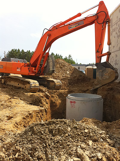 330 Excavator and 24′ deep concrete wet well